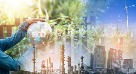 外的要因に左右されない事業継続や製造業のDX・持続可能性をイメージさせる、ECO地球のホログラムと工場・都市の風景